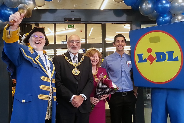 Town Crier Peter Taunton, Mayor and Mayoress, Surinder and Cecile Biant and Lidl Store Manager Benji Steele