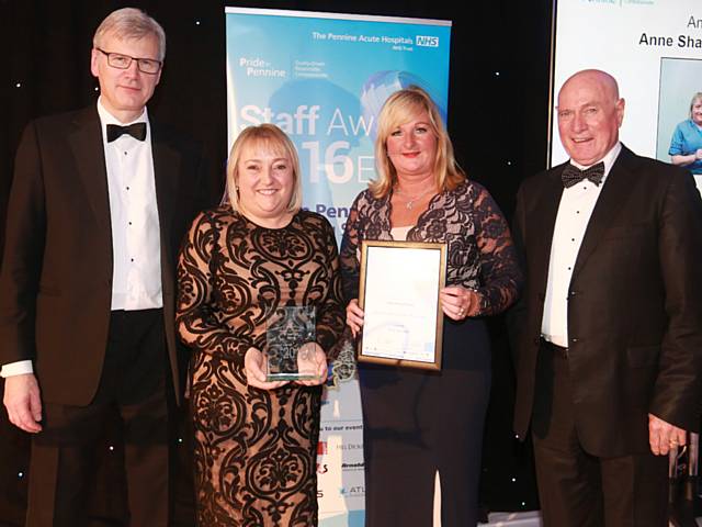 Anne Sharrocks receives the Nurse of the Year Award from Trust chief executive Sir David Dalton, Trust chairman Jim Potter and Helen Moreland of G4S Facilities Management.