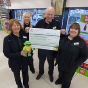 Springhill’s mascot ‘Springy’, Julie Nield, Natalie Burns, store manager Paul Hart and team manager Diane Watling