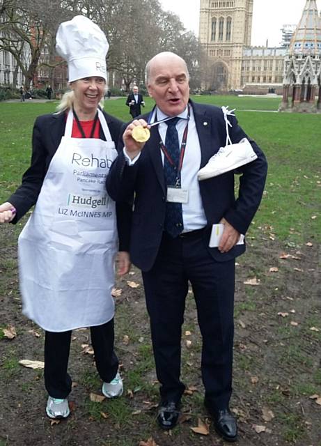 Liz McInnes flipping pancakes for charity in this year's Rehab Parliamentary Pancake Race at the Houses of Parliament