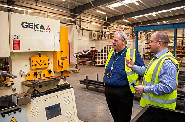 Company Director Duncan Parker (right) shows Council Leader Richard Farnell one of th new machines at A&F Sprinklers Ltd
