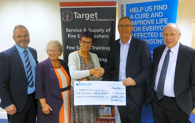 Martin Hirst, Barclays Business Manager; Doreen Scott, Vice Chairperson for Parkinson; Dulcie Bolton, Chairperson for Parkinson; David Harris, Company Director for Target Fire; Dave Richardson, Fundraiser for Parkinson