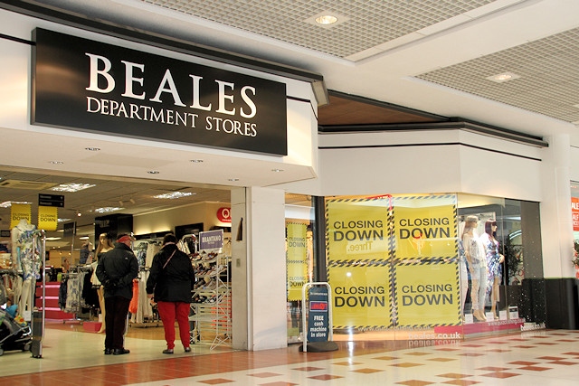 Closing down signs in the shop windows at Beales