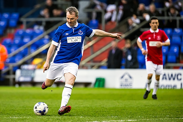 Oldham Athletic boss John Sheridan shoots in the charity football game to raise funds for Ellis Robinson