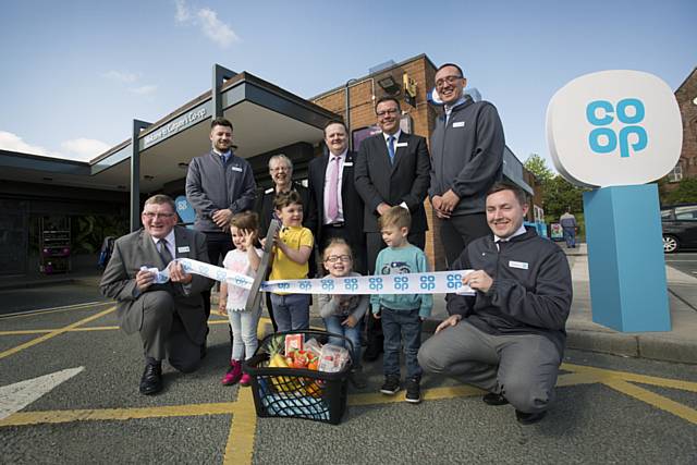 Children from Oulder Hill Playgroup, Pippa Jo Yates, Ike Yates, Olivia Storm Sutcliffe-Poole and Charlie Flynn help the Co-op team and guests of honour to launch the new foods store in the Cutgate shopping centre, Rochdale 