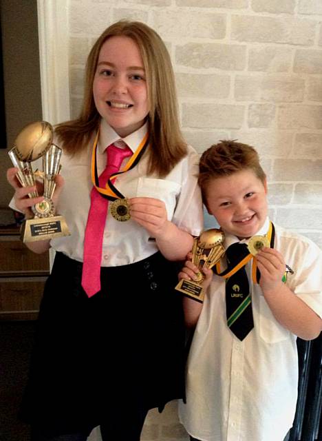 Rugby playing Hollie and Josh Dews with thier 'clubman' trophies