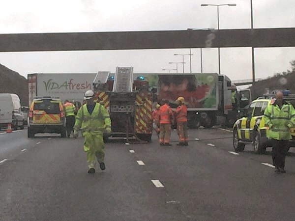Severe delays as crashed lorry blocks all lanes on M62