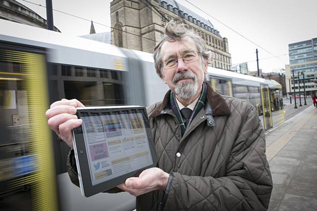 TfGM Committee Chairman Councillor Andrew Fender using the free wi-fi