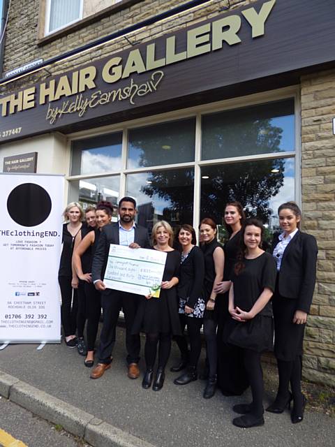 Kelly Earnshaw of The Hair Gallery and Asif Ali, The Clothing End raise over £1800 for Springhill Hospice