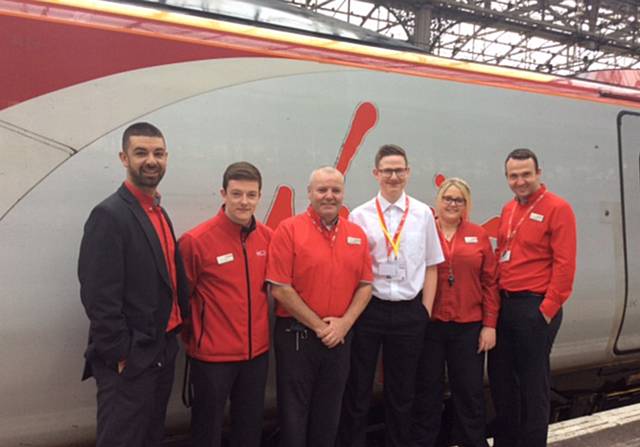Sam George working with the Virgin trains’ team at Manchester Piccadilly Station