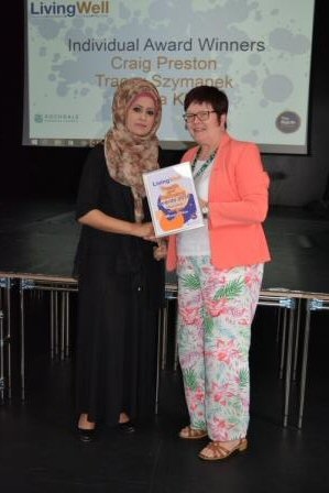 Maniza Khan presented with he award by Councillor Janet Emsley