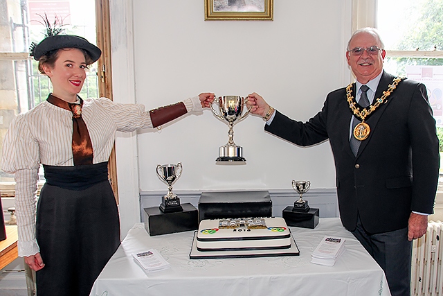 Rebecca Stephenson playing the part of Queenie Newall, in authentic period costume, with the Mayor of Rochdale Ray Dutton at the Sybil Fenton Newall commemoration event