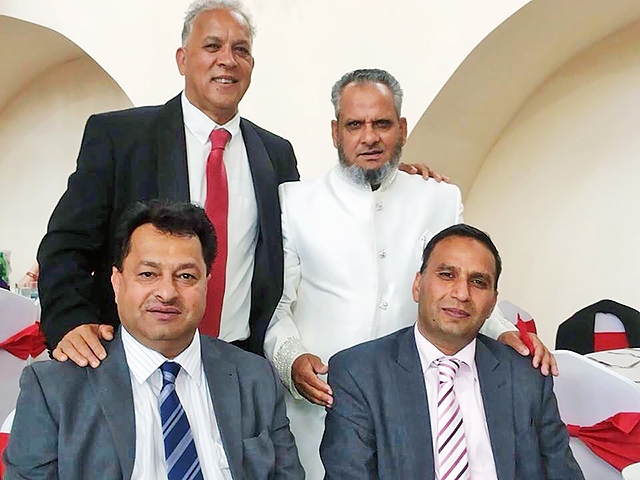 Raja Mohammad Yaseen (in white) with Councillor Daalat Ali,
Councillor Iftikhar Ahmed and Councillor Shakil Ahmed