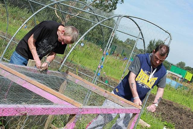 VIC member Keith Edgar and VIC Outreach Worker Tony Stubbs creating a chicken coop for the allotment in Middleton
