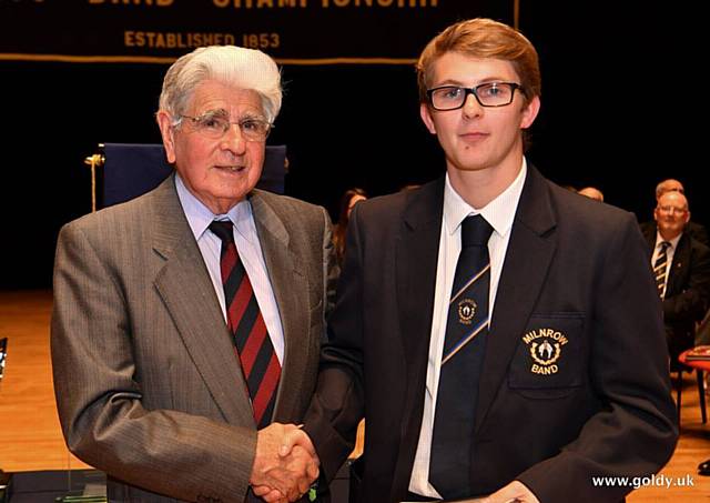 David Read MBE, a Trustee of the Harry Mortimer Memorial Trust presenting the award to Christopher Musgrove, student of Birmingham Conservatoire and he played soprano cornet for Milnrow Band in the contest   
