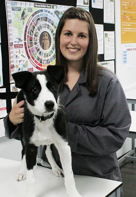 Kirsty Holt and Cliff the dog who is being looked after in the kennels at Hopwood Hall College