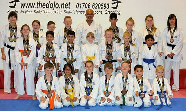Members of The Dojo Karate Centre with their medals 