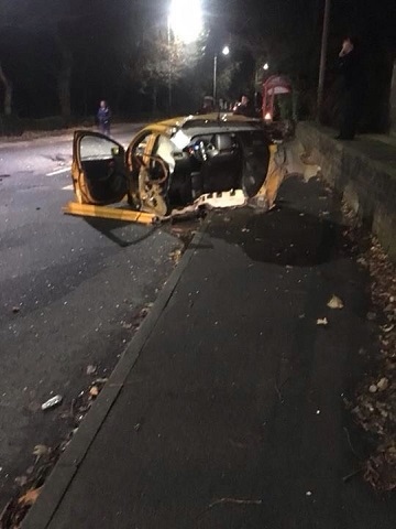 Car split in two after hitting bus stop in Whitworth