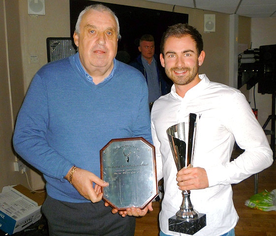 Norden Cricket Club chairman John Murphy presenting player of the year Josh Tolley with his trophy