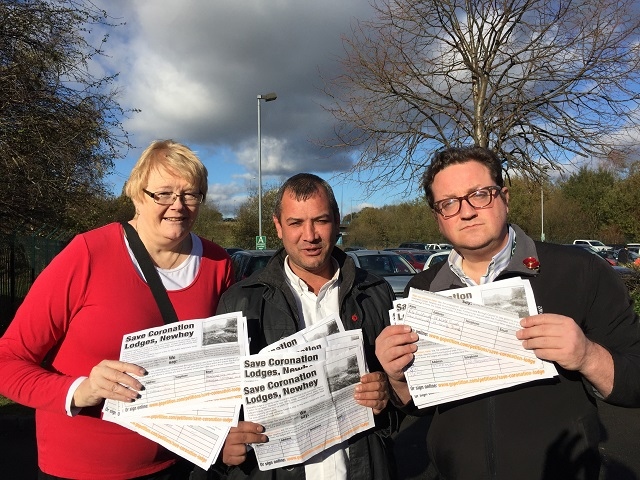 Cllrs Irene Davidson and Andy Kelly with Dave Bamford (centre) and the petition to save Coronation Lodge in Newhey