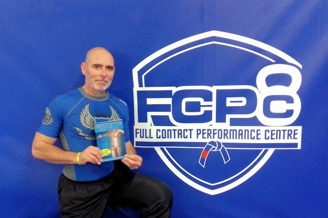Dr David Penney with his book at the Full Contact Performance Centre
