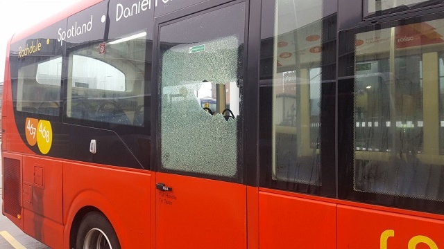 464 Rosso Bus damaged by school children with bricks