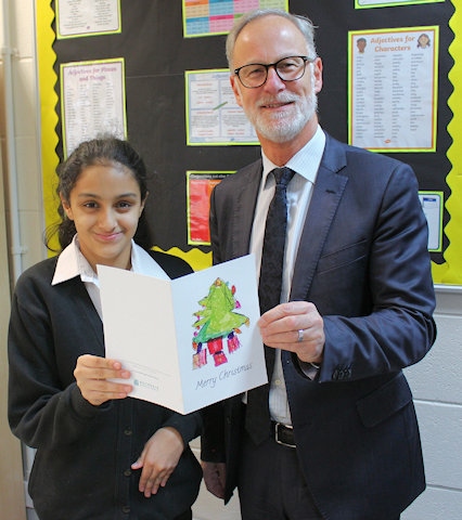 Council Chief Executive Steve Rumbelow with Sana Ahmad at Redwood School with the 2017 Christmas card