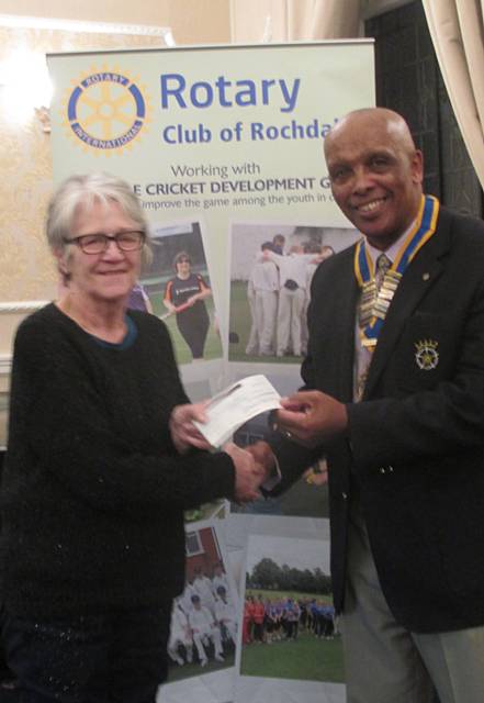 Rochdale Rotary Club President John Holder with Elaine Royds, Rochdale Cricket Development Group