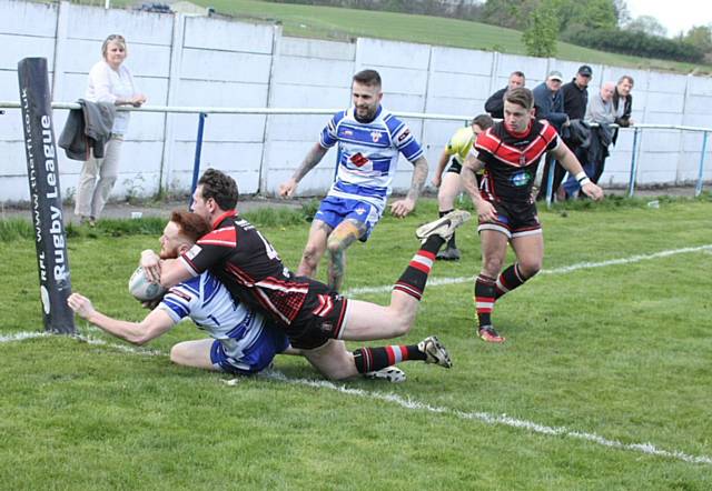 James McDaid smashes over for a try