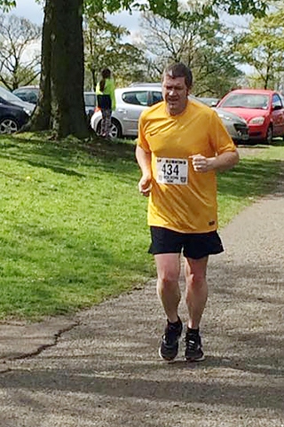 Councillor Chris Furlong running in the Bolton 10k