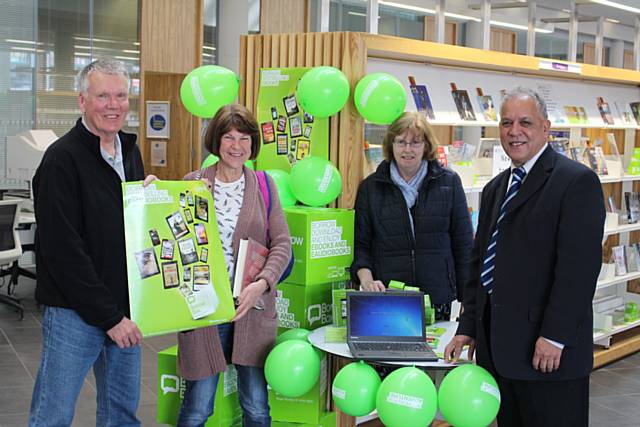 Councillor Daalat Ali (right) cabinet member for libraries, with customers at the launch of the BorrowBox app