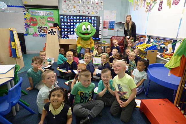 Children at Holy Family RC Primary, Kirkholt dressed in green