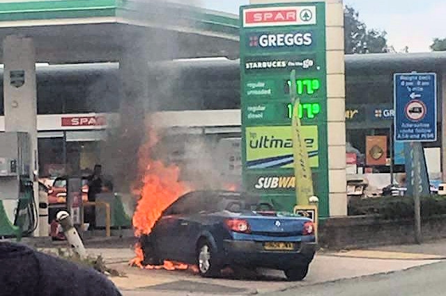 The car burst into flames at the BP petrol station on Bury New Road in Heywood