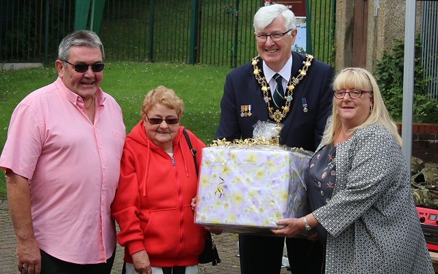 Rick and Barbara Todd are presented with a ‘thank you’ gift by Mayor Ian Duckworth and Greave Community Base secretary Dawn Fairclough