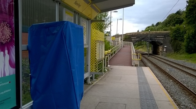 The damaged ticket machine on the Rochdale bound platform at Newhey 