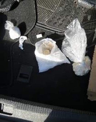 Contents of white bag: 371g heroin, 116g crack, 81.9g cocaine