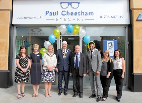 Paul Cheetham and his colleagues with the Mayor and Mayoress outside the opticians