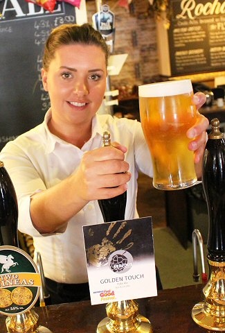 Sabrina White serves a pint of Golden Touch at The Flying Horse