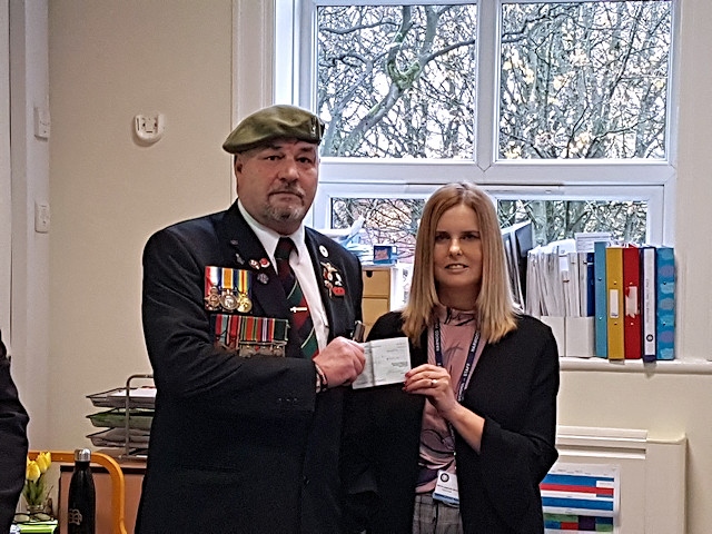 Chris Harris presents the cheque to Mrs Davies