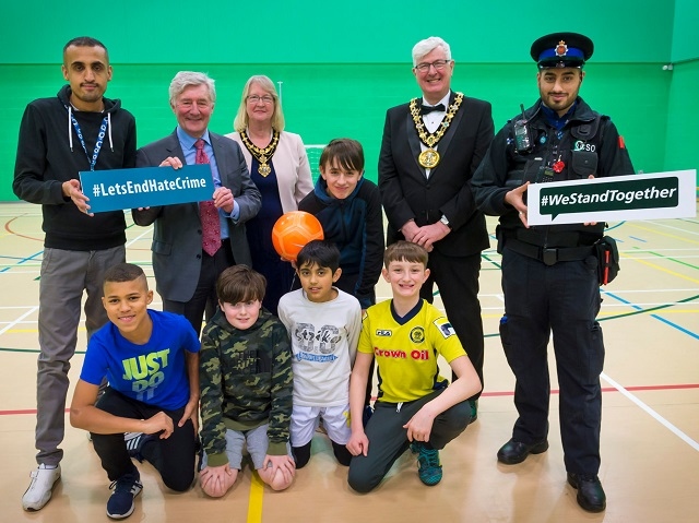 Nadeem Hussain (youth worker), Tony Lloyd MP, Mayor and Mayoress, Ian and Christine Duckworth and PCSO Sohail Hussain with youngsters at the hate crime football tournament