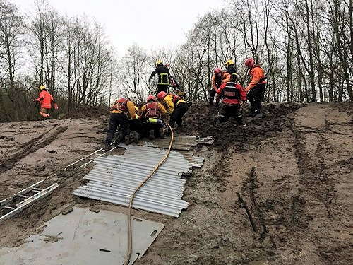 Firefighters rescue two children from mud