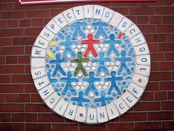 Ceramic displays featuring the Unicef and Rights Respecting Schools Award logos at Castleton Primary School