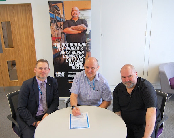 NHS HMR CCG Chief Officer Simon Wootton and NHS HMR CCG Chairman and local GP Dr Chris Duffy signing the NHS Smokefree Pledge, with ex-smoker Dave Gorner 