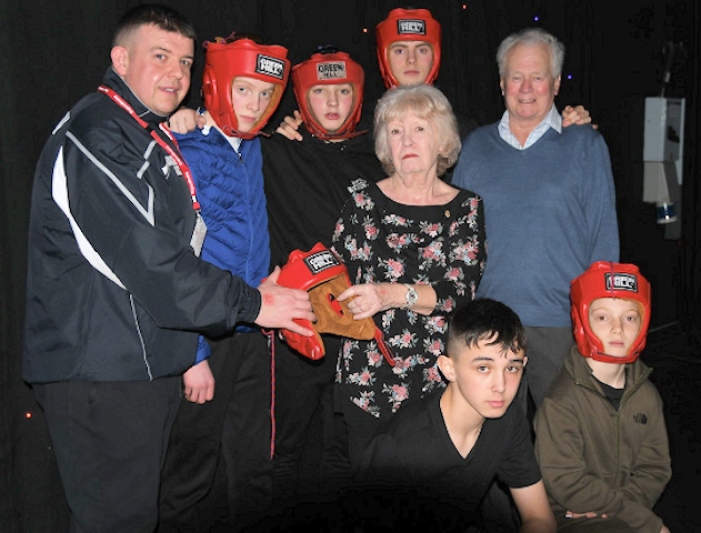 Middleton Rotary President Janice Powell and Rtn Norman Wellens with members of Boarshaw Boxing Club