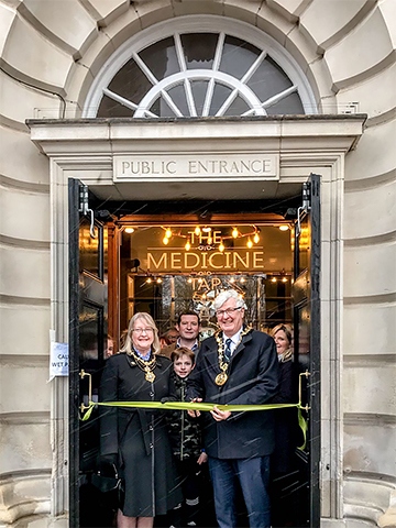 Mayor Ian Duckworth cuts the ribbon officially opening the Medicine Tap watched by owners John Stoner and Caroline Norton, and the Mayoress Christine Duckworth