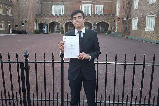 Sohail Turner with his certificate outside St James' Palace