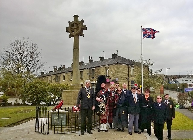 Mayor Ian Duckworth, councillors, veterans and local residents see the new flag raised in Norden Memorial Gardens