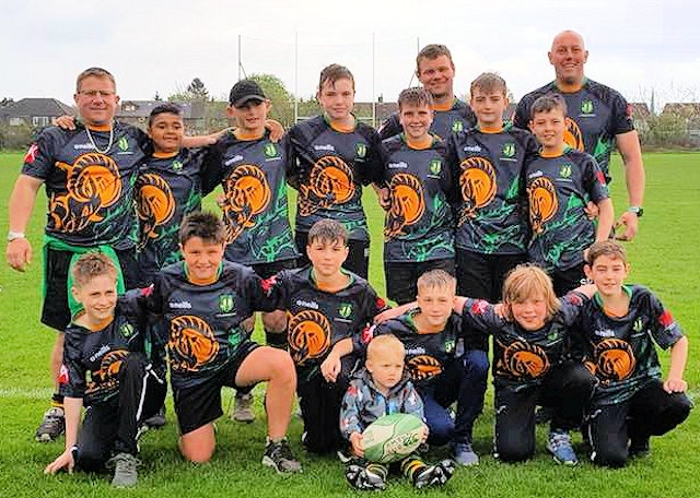 Littleborough Rugby Club U12s showing off their tour tops courtesy of Baxters Builders