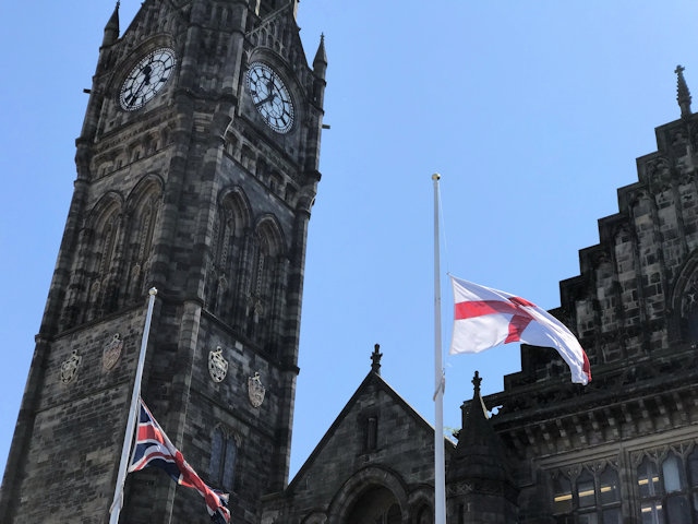 Flags lowered outside the Town Hall in remembrance of the victims who died in the Manchester Arena bombing