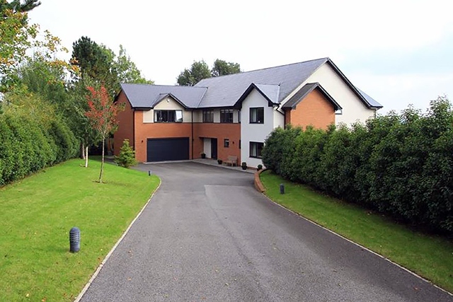A five-bedroom property in Bamford, Rochdale currently for sale for £1,295,000 via Adamsons